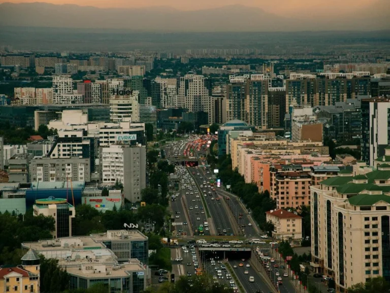 Tourists walking through Almaty city centre on a guided city tour in Kazakhstan