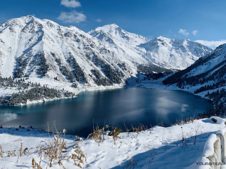 Big Almaty Lake and snowy peaks of the Ile-Alatau in winter