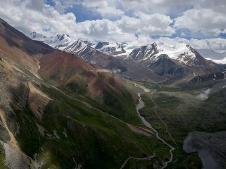 Wide green valley and mountain slopes in Ile-Alatau National Park near Almaty